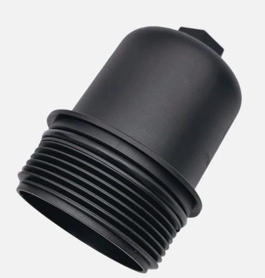 Black transmission filter housing with ridged threaded end