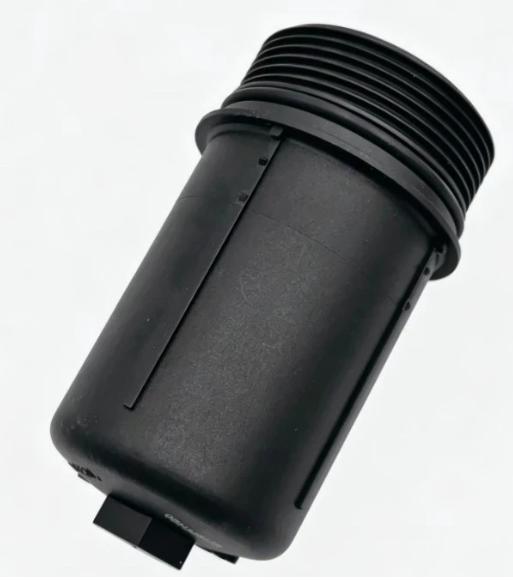 DSG transmission filter, dark plastic cylinder with ribbed threads and side latch tab