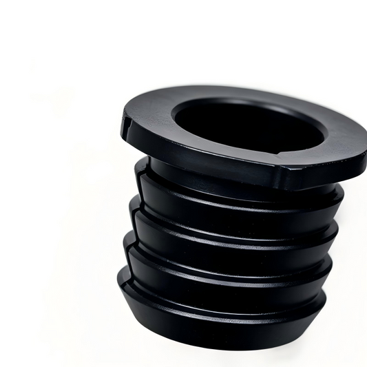 Black EVAP canister seal with central bore and stepped ridged profile