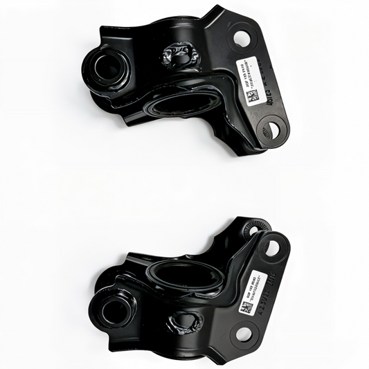 Pair of black control arm brackets with bushing openings and mounting bolt holes