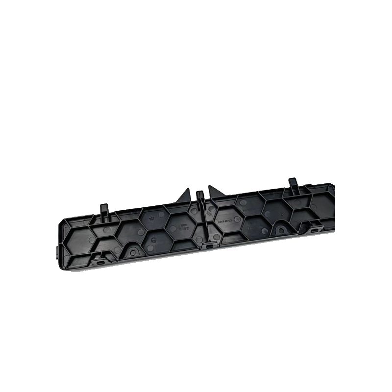 Black cabin air filter cover with embossed hex cells and raised locking clips