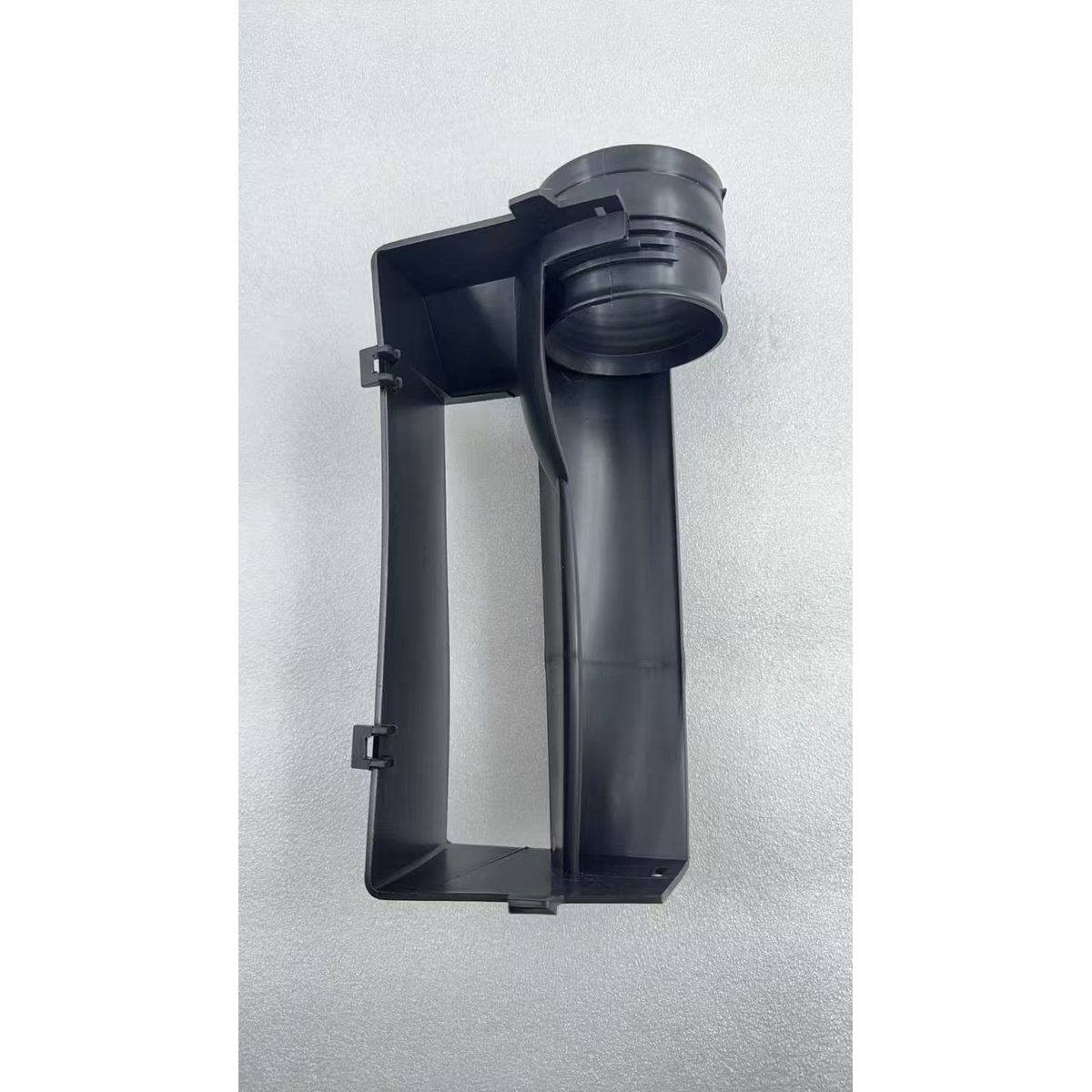 Black plastic air intake duct frame with cylindrical intake outlet and mounting clips
