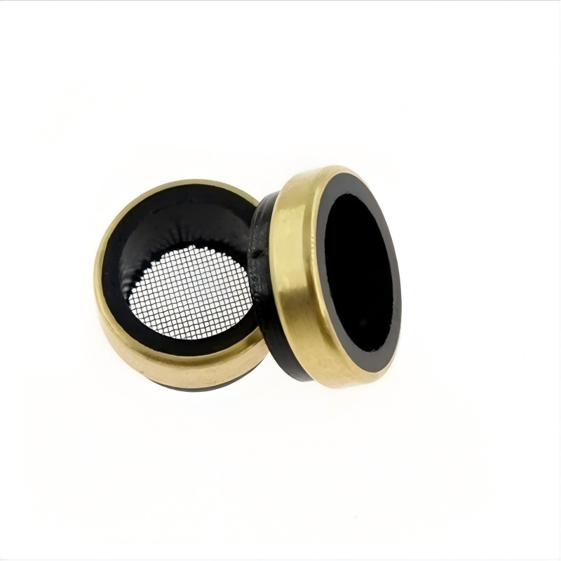 Cylinder head oil screen insert with mesh filter, brass-colored rim and black housing