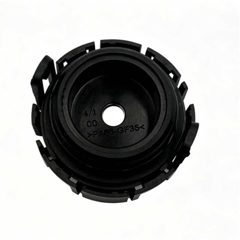 Black vacuum check valve cap with circular plastic housing and mounting tabs