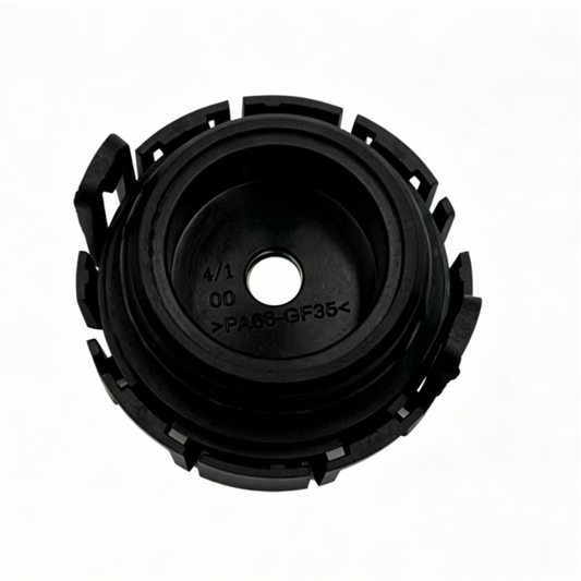 Black vacuum check valve cap with circular plastic housing and mounting tabs