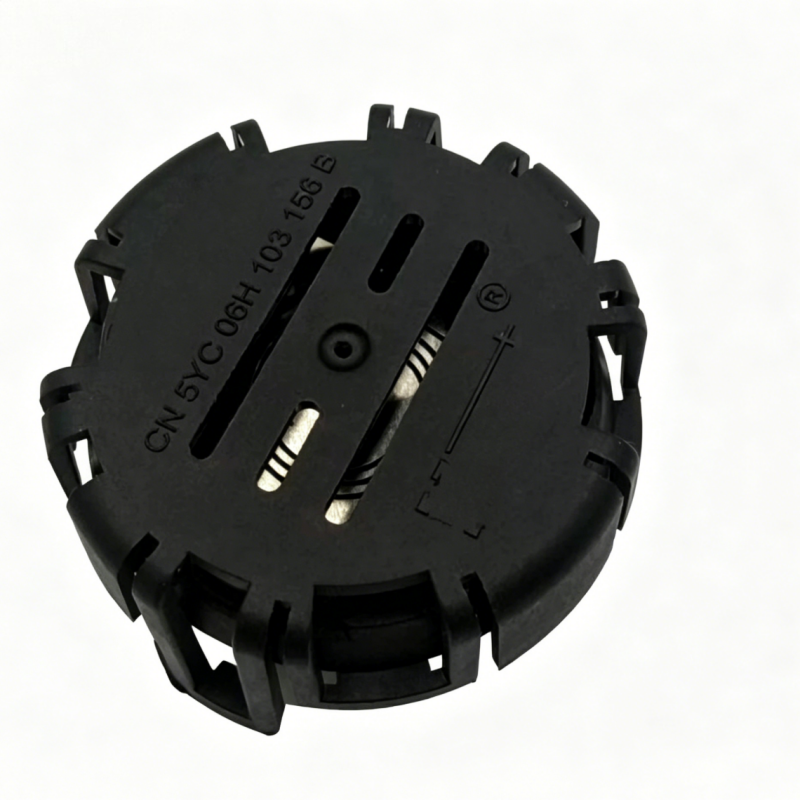 Black vacuum check valve housing with embossed markings and metal contact slots