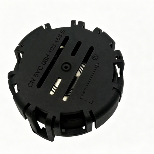 Black vacuum check valve housing with embossed markings and metal contact slots