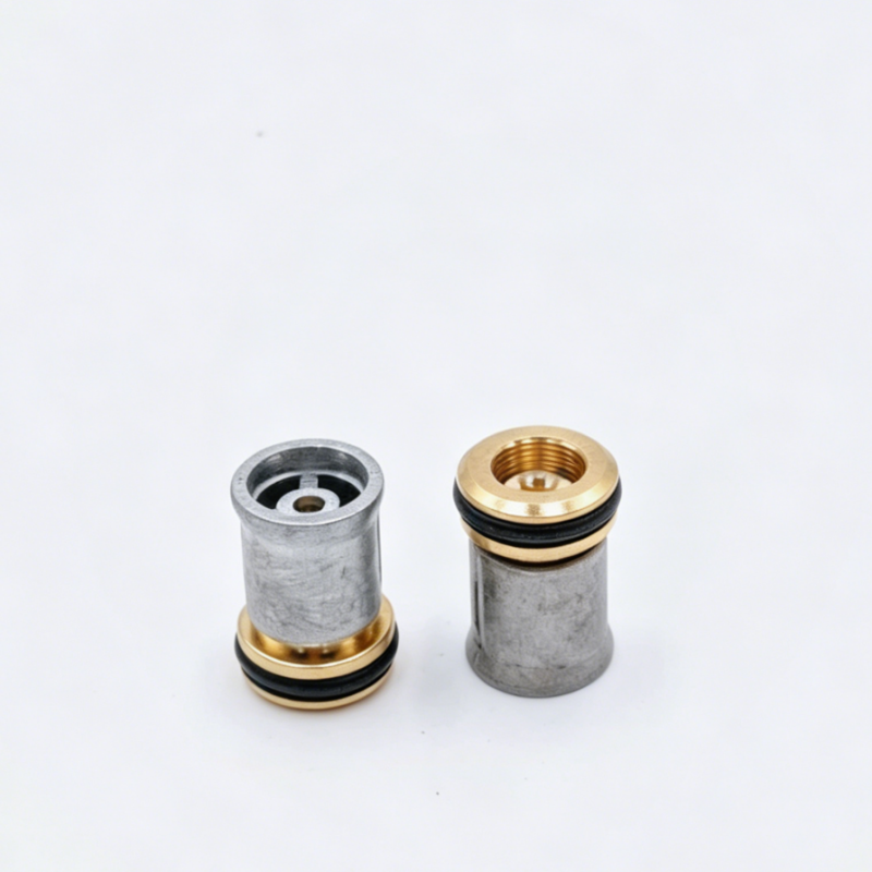 Engine check valve with gray cylinder body, brass top ring, and threaded outlet.