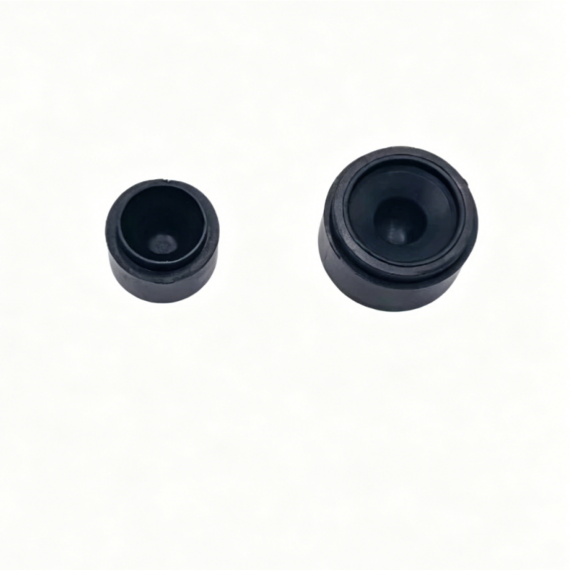 Round black rubber buffer pair, one small and one larger with center recess