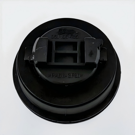 Black engine oil filler cap underside with molded part numbers and clips
