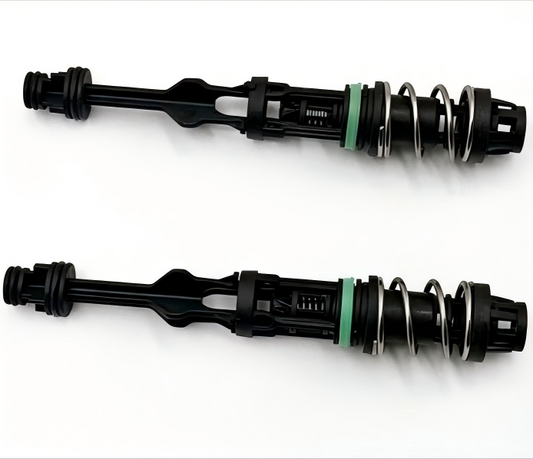 Oil filter housing tube with black body, green seal, and metal spring
