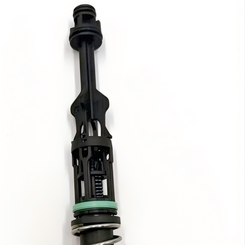 Oil filter housing tube connector with green seal and black plastic housing