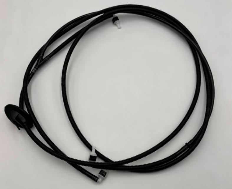 Black windshield washer hose with molded connectors, neatly coiled