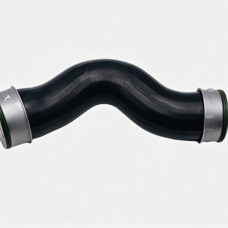 Curved black turbo boost pipe with green rubber ends and metal clamp fittings