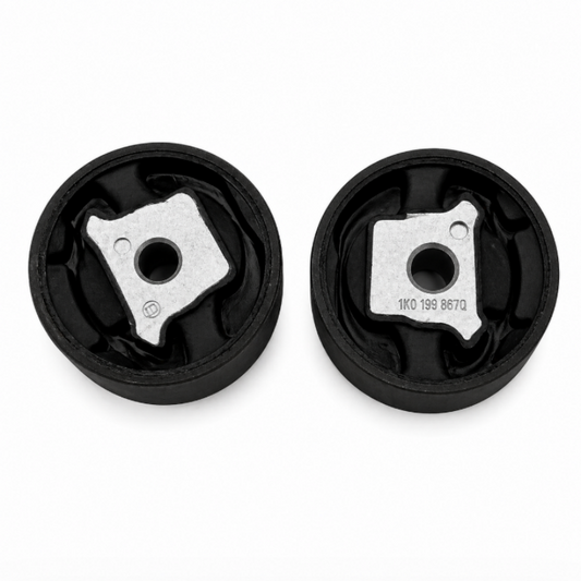 Pair of black subframe bushings with metal mounting plates and central bolt holes