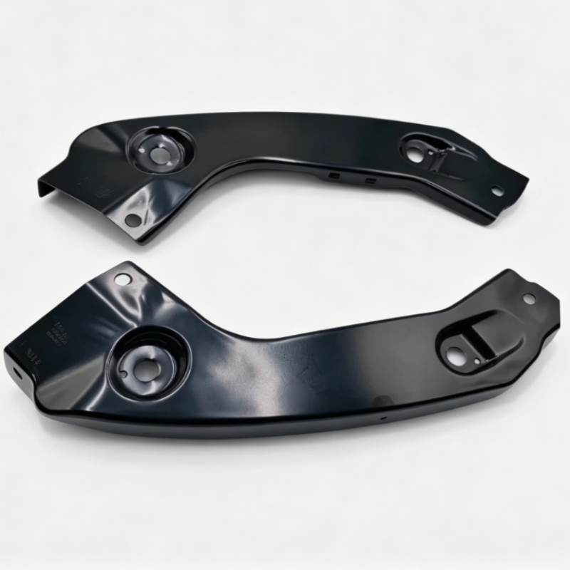 Pair of black metal headlight mounting brackets with circular mounting holes