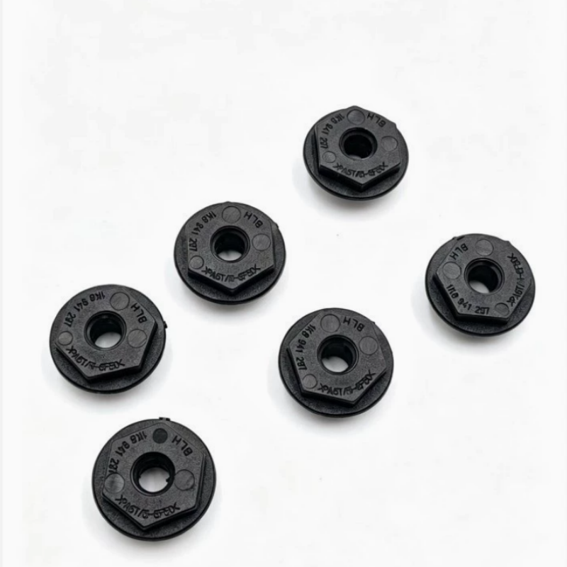 Set of black plastic headlight mounting brackets with center holes