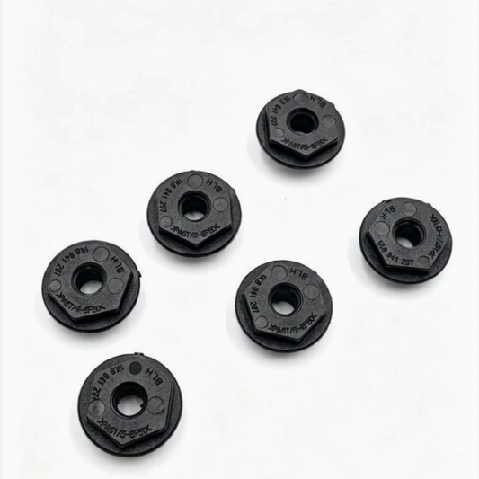 Set of black plastic headlight mounting brackets with center holes