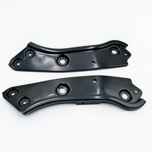 Pair of dark metal headlight mounting brackets with bolt holes and center stud