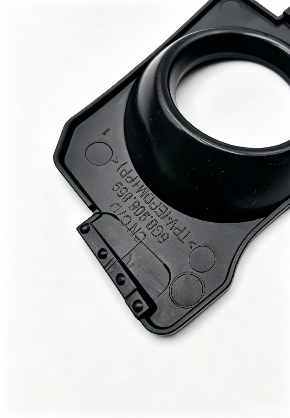 Black ignition coil boot with circular opening and molded markings
