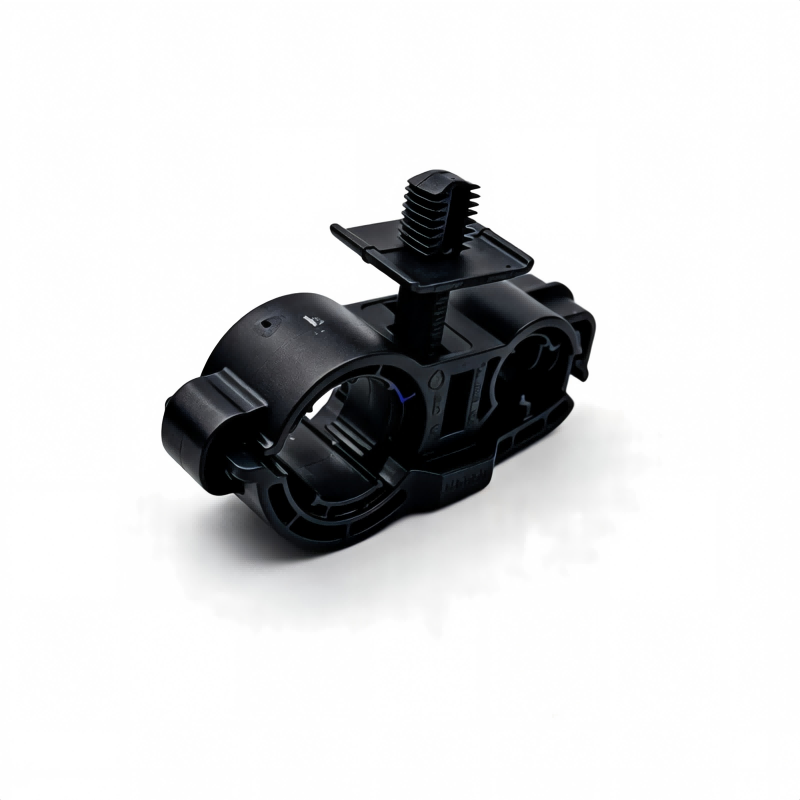 Black A/C pipe bracket with lever and spring clip, molded plastic