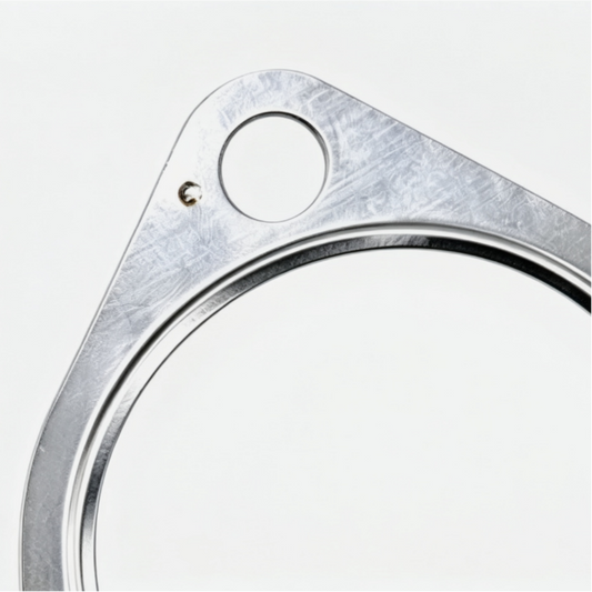 Exhaust gasket with triangular metal plate, circular sealing ring, and two bolt holes