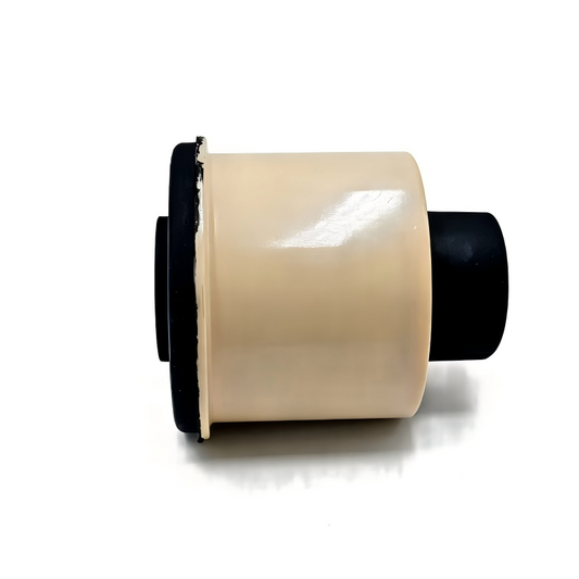 Rear axle bushing with beige polyurethane body and black rubber outer