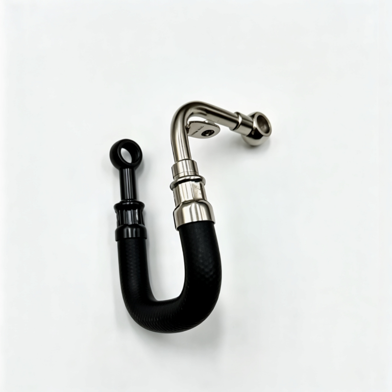 Black turbocharger boost pipe with metal fittings and silicone hose, U-shaped