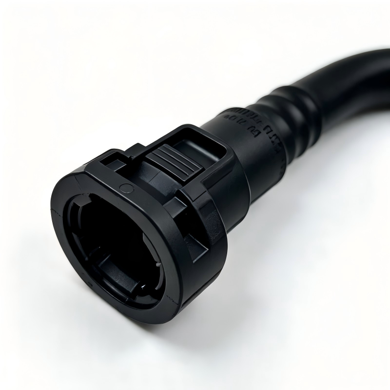 Black vacuum hose connector with molded elbow and electrical-style plug end