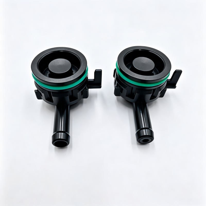 Crankcase ventilation valve pair, black housing with green sealing ring and outlets