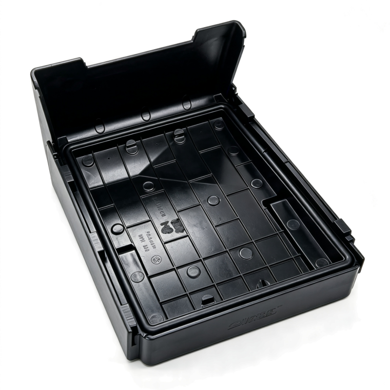 VW fuse box cover, black plastic with open tray and recessed slots