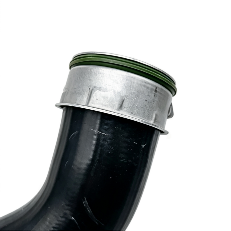 Black turbo hose with silver clamp ring and green sealing edge
