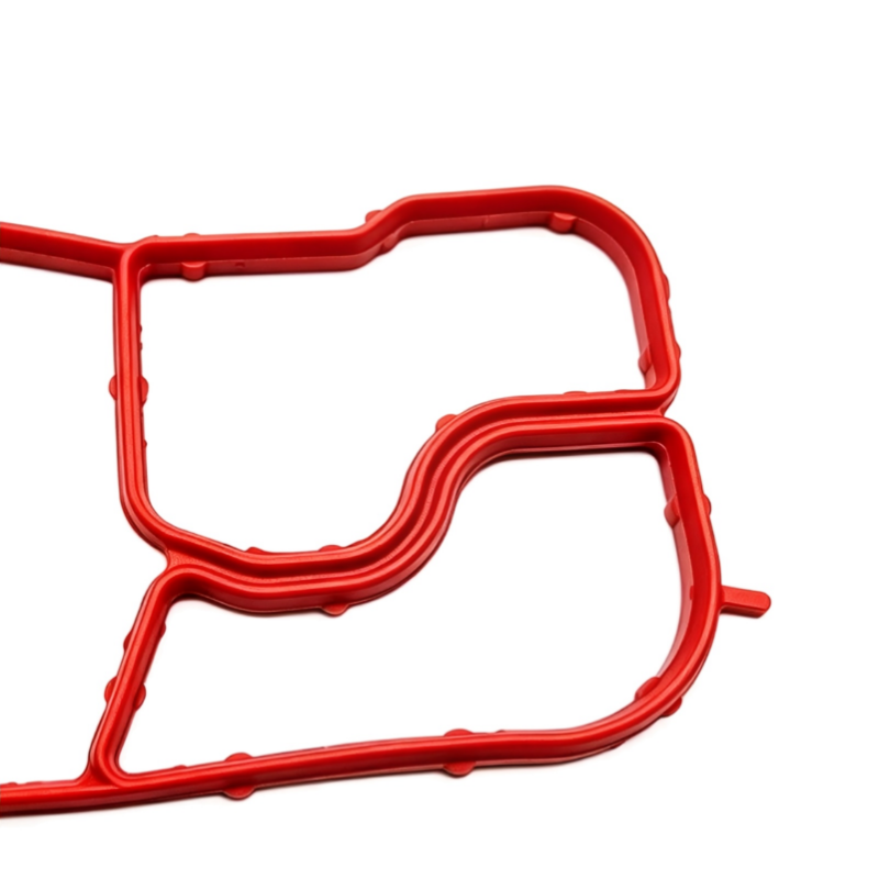 Oil cooler seal gasket, red molded rubber with sealing channels and cutouts