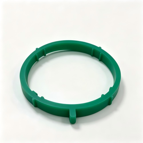 Green intake pipe sealing ring with locking tabs, circular shape.