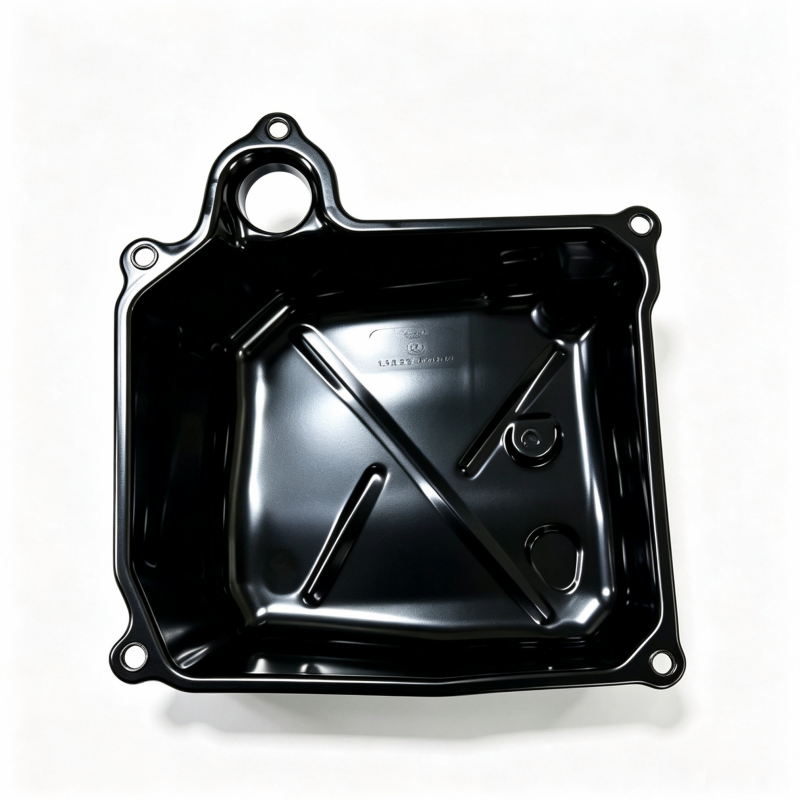 Black engine oil pan underside with center circular opening and four corner holes