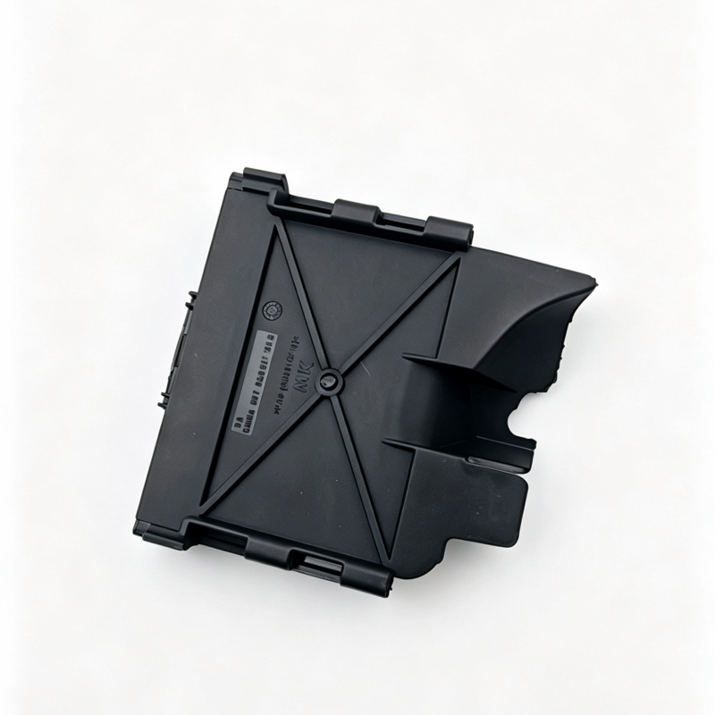 Black fuse box cover with top latch clips and molded side cutout