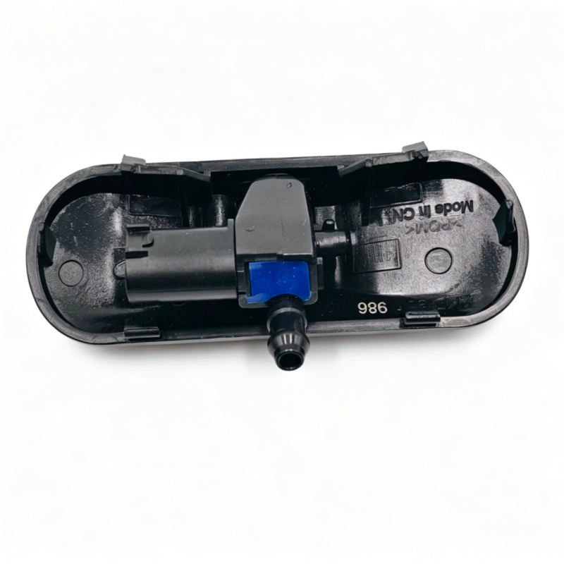 Windshield washer nozzle housing, black interior with blue connector and front nozzle tip