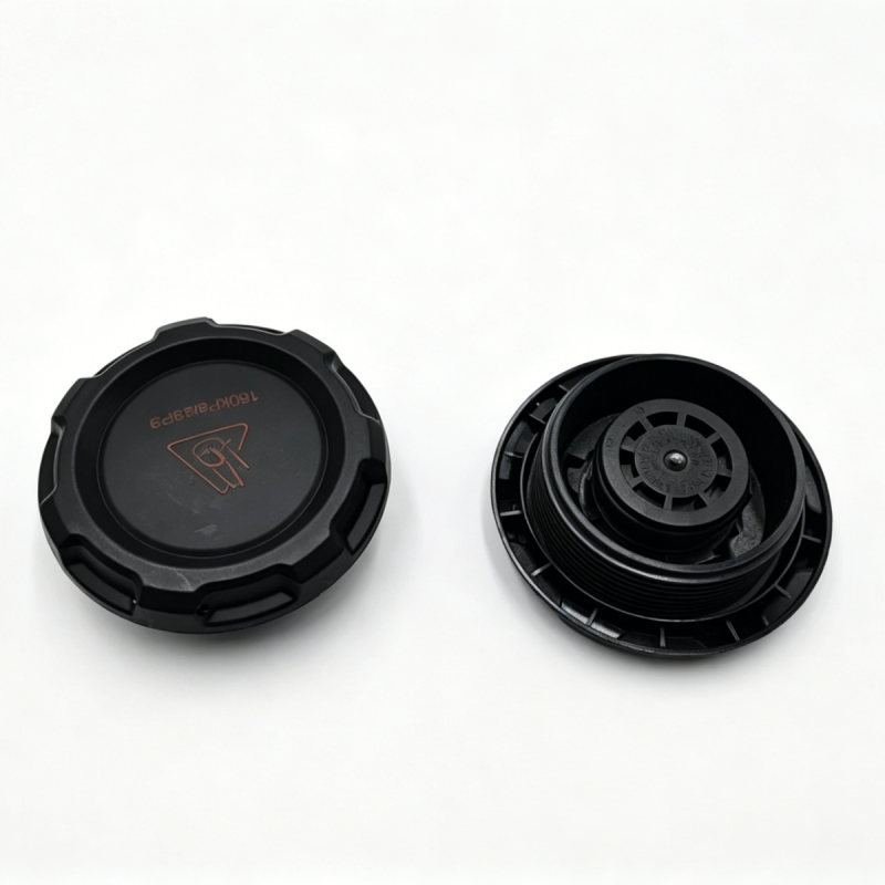 Black coolant reservoir cap, top view and underside showing vented interior.