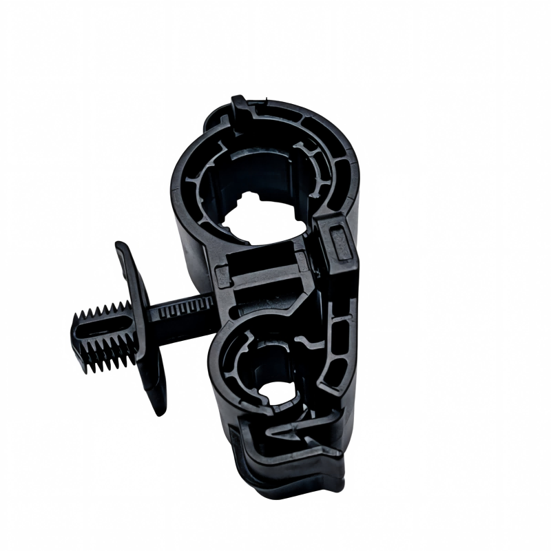 Black A/C pipe bracket housing with threaded fastener and mounting tab