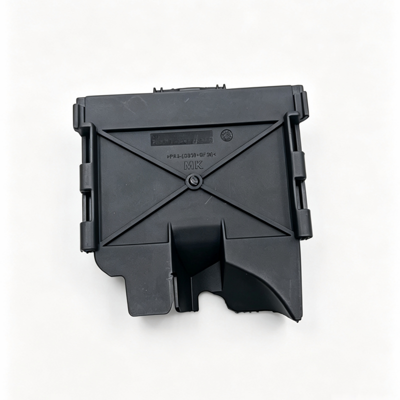 Black fuse box cover with triangular pattern and central fastener