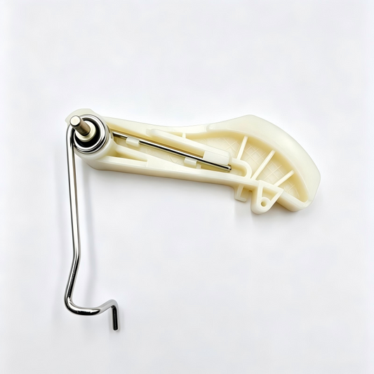 Timing chain tensioner with cream guide rail and silver adjustment pivot end.
