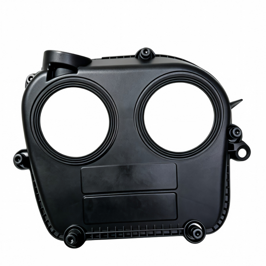 Black timing belt cover housing with two round openings and side hose outlet