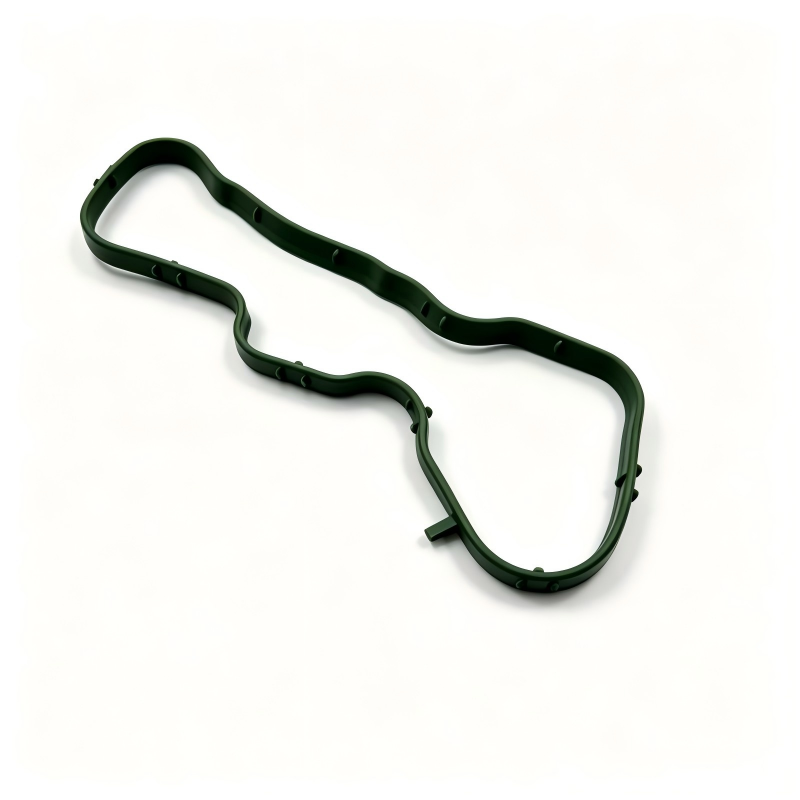 Left intake manifold gasket, green wavy seal with cutouts and mounting holes