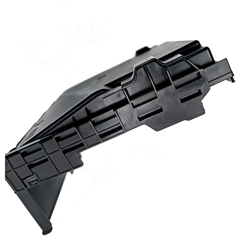 VW fuse box cover, black plastic base with mounting clips and side channels