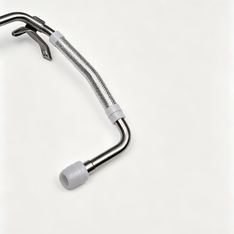 Turbo boost pipe with braided hose, curved metal bends, and gray end cap