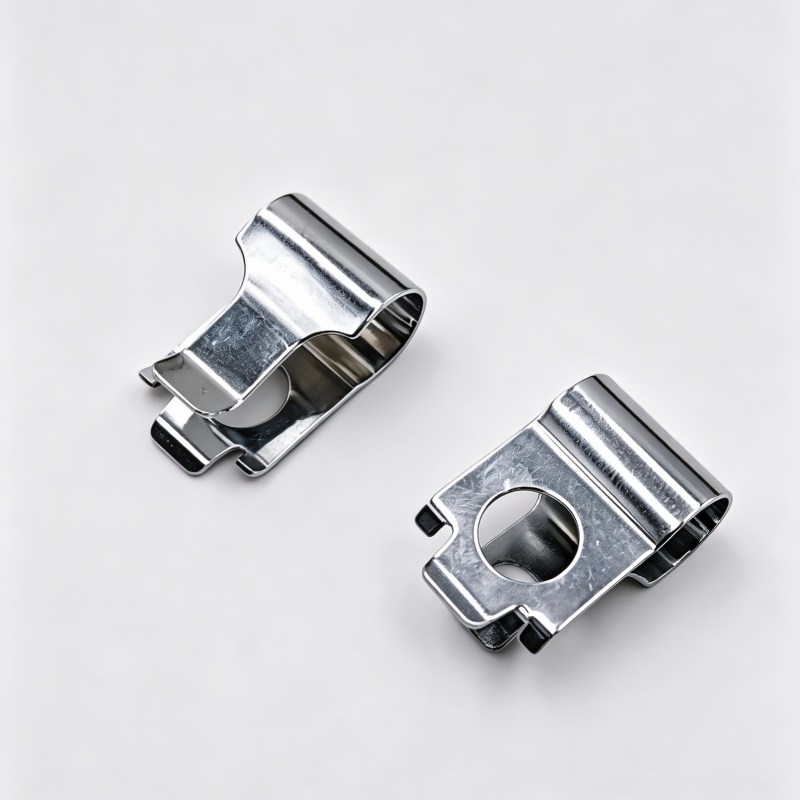 Pair of silver metal turbo wastegate actuator clips with circular hole and tabs