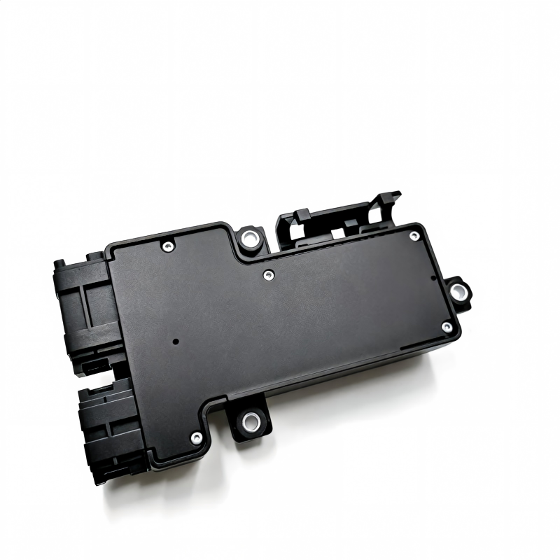Dark plastic seat switch control module with connector ports and mounting holes