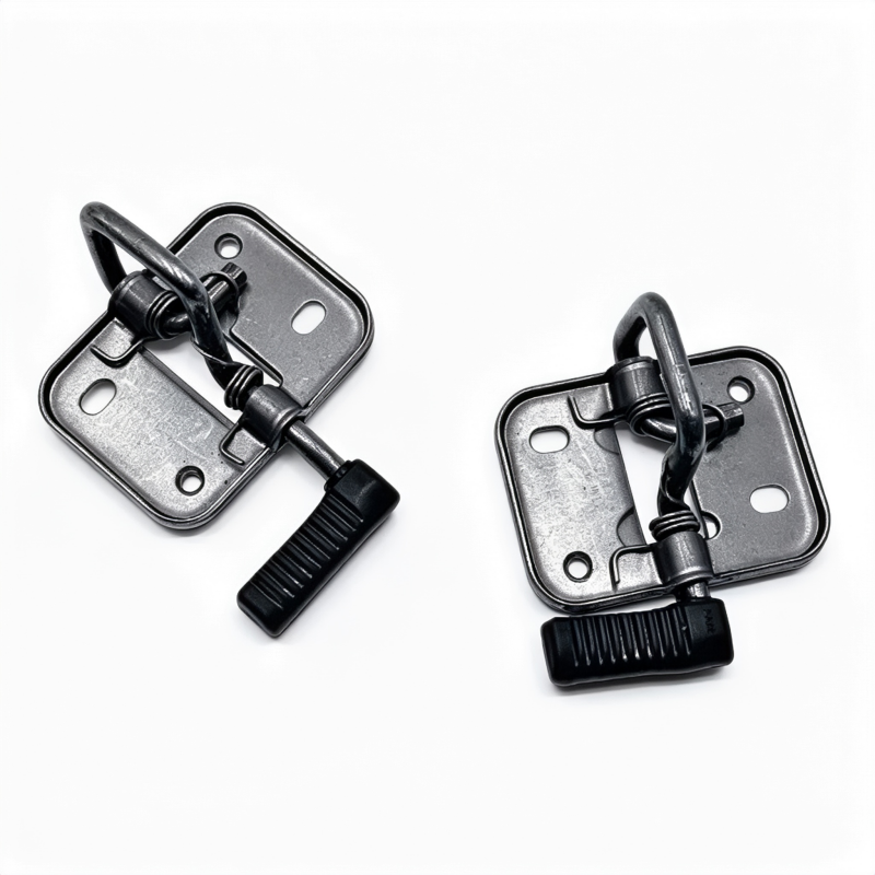 Pair of metal hood latch releases with black pull levers and mounting holes