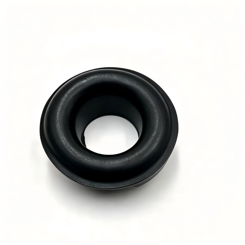Rear coil spring lower pad, black rubber bushing with center hole (top view)
