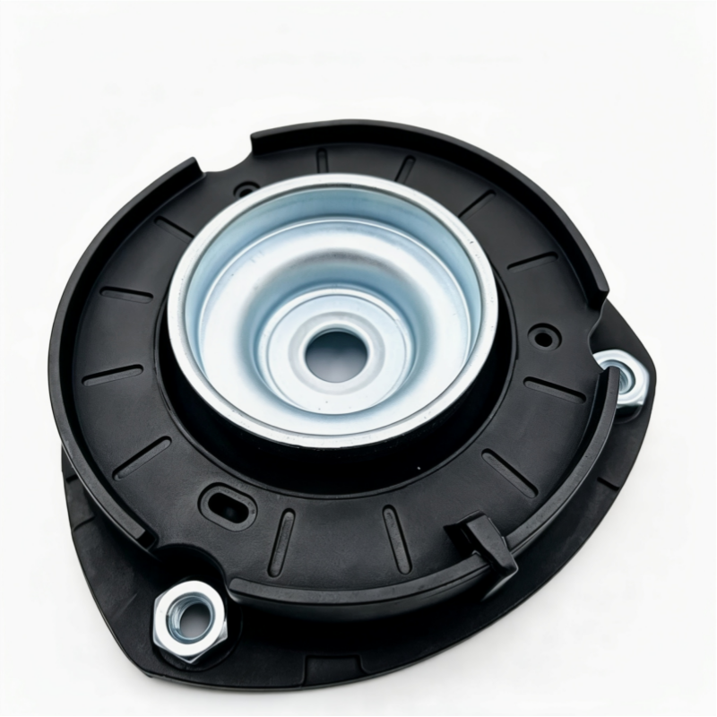 Front strut mount assembly with black housing and exposed silver metal center plate